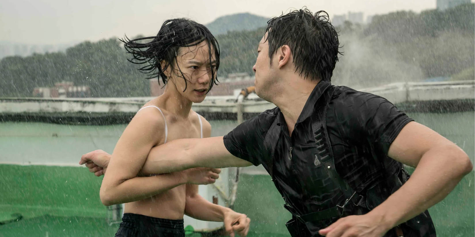 Sun fighting a in the rain, looking exhausted but determined, in the TV series Sense8.