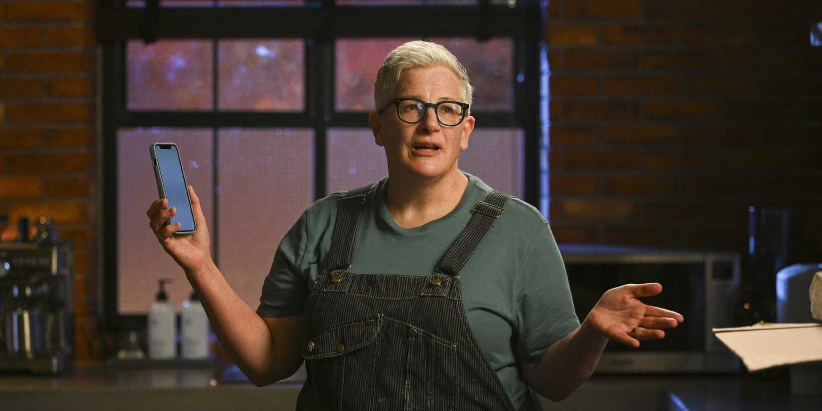 Abby McEnany as Velma Bruin with her phone in her hand in the Tracker season 2 premiere