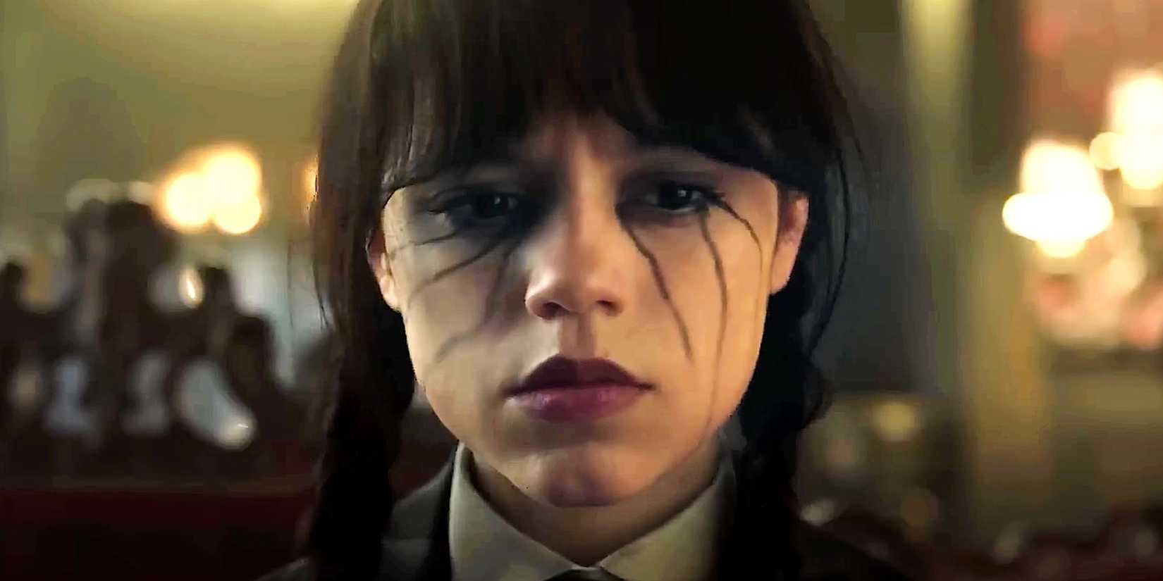 Wednesday Addams looking disappointed with black tears streaming down her face in Wednesday season 2