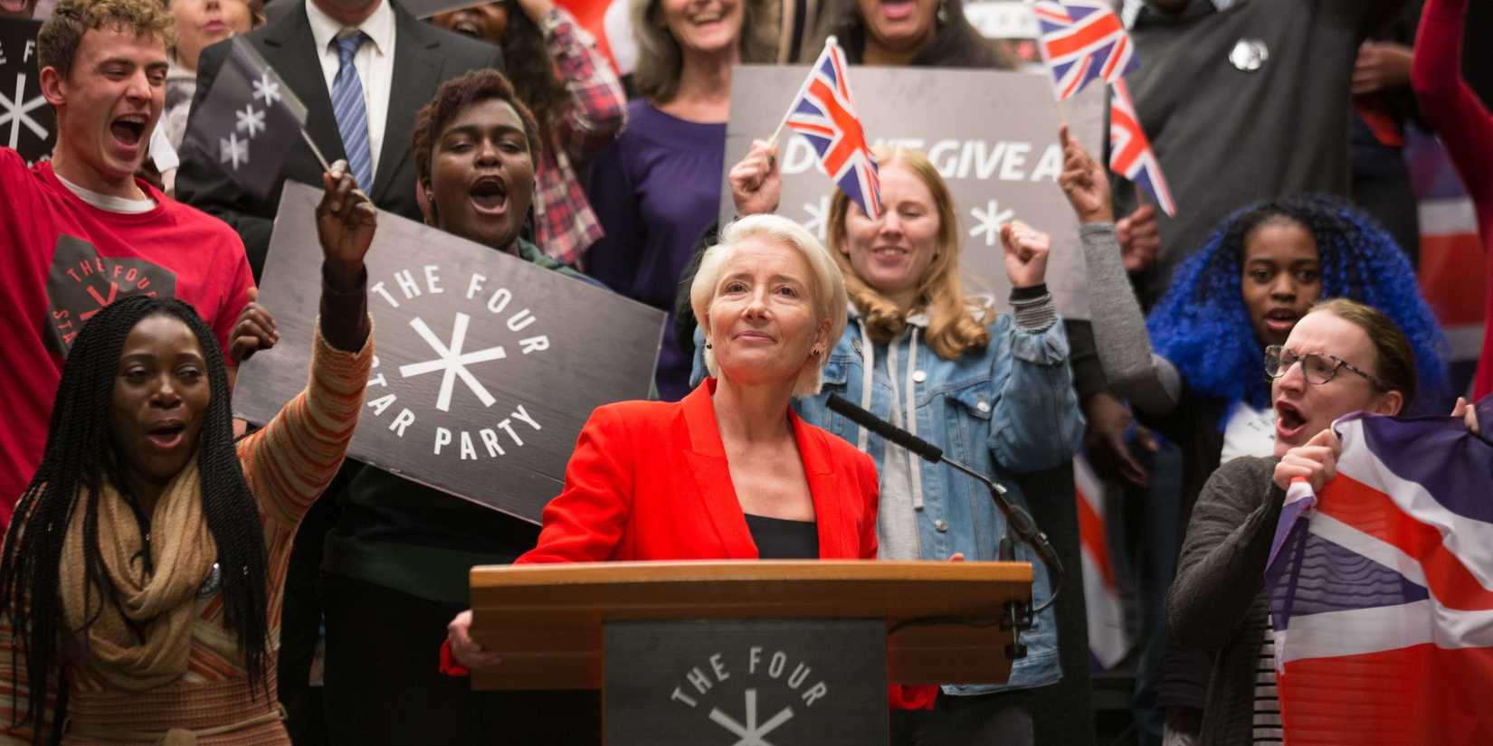 Vivienne Rook (Emma Thompson) smugly smiling at a podium in front of cheering fans in Years and Years.