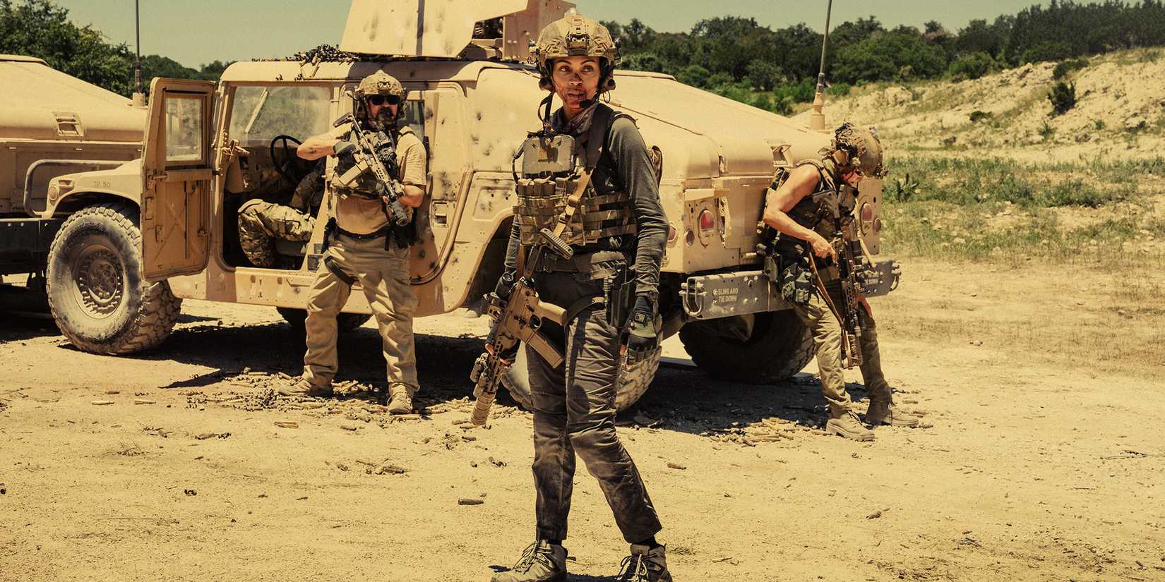 Zoe Saldaña's Joe looking distraught while standing in front of a truck in Lioness season 2