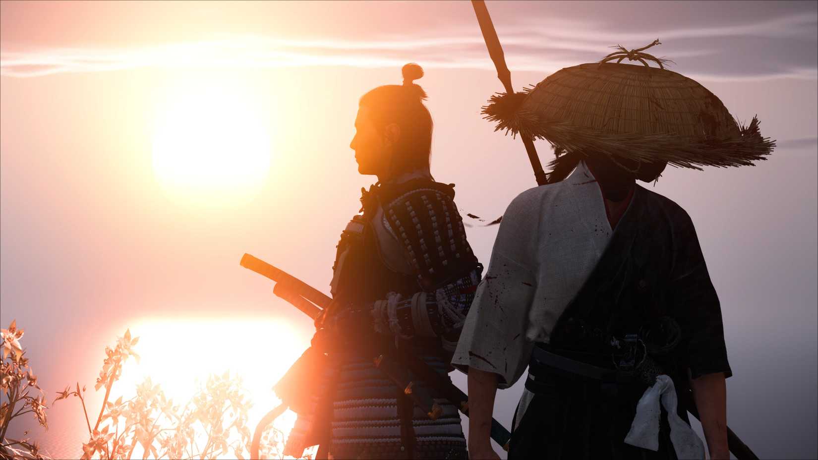 Atsu and Jubei stand back-to-back in front of the setting sun.