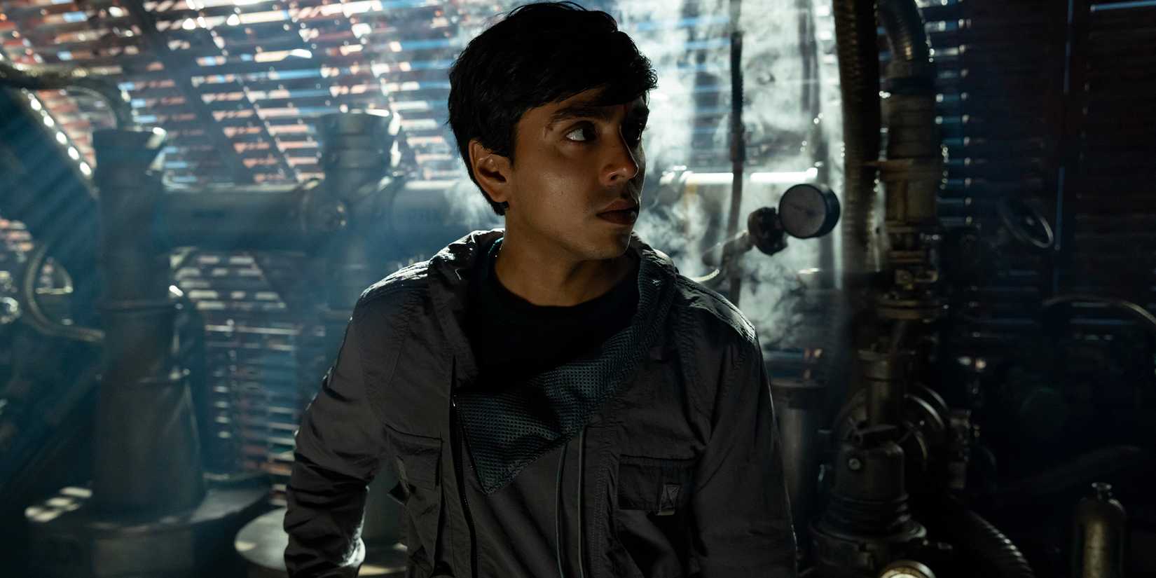 Adarsh Gourav's Slightly looking worried while in a section of the ship in Alien: Earth season 1