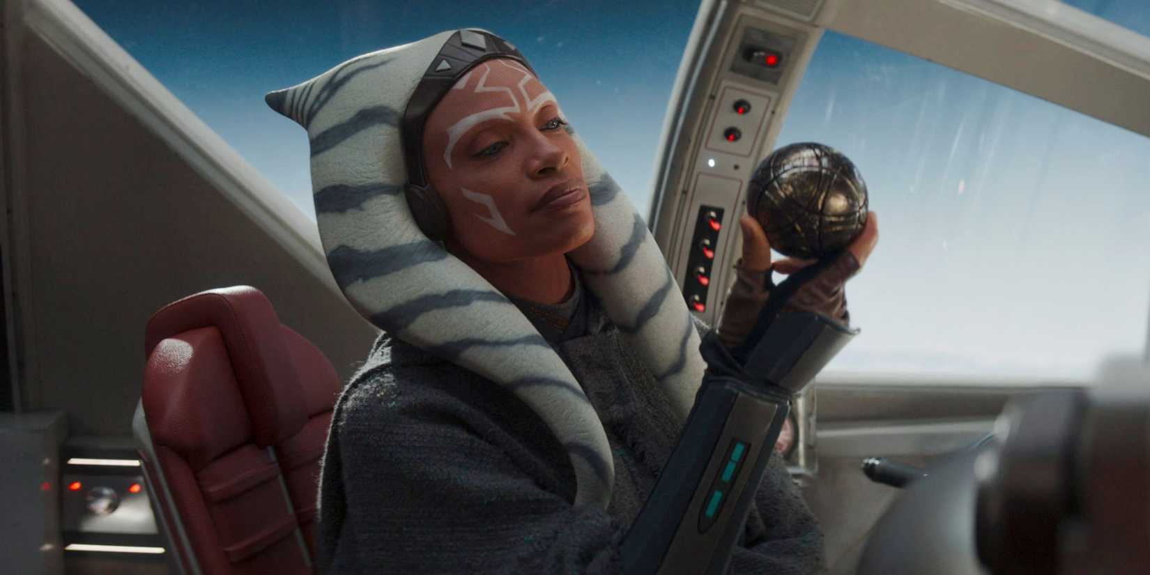 Rosario Dawson as Ahsoka Tano holding a sphere in Ahsoka 