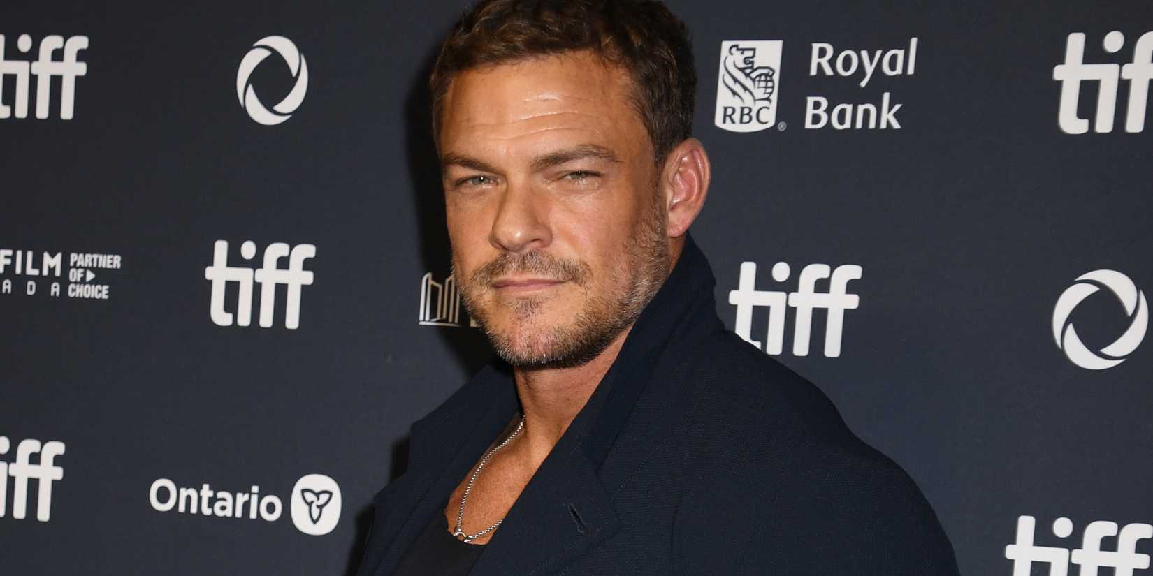 Alan Ritchson at the Motor City premiere looking into camera