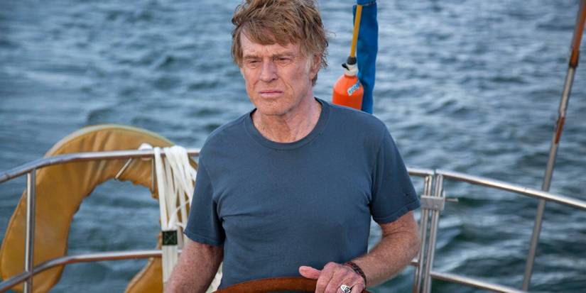 Robert Redford steers a boat in All is Lost