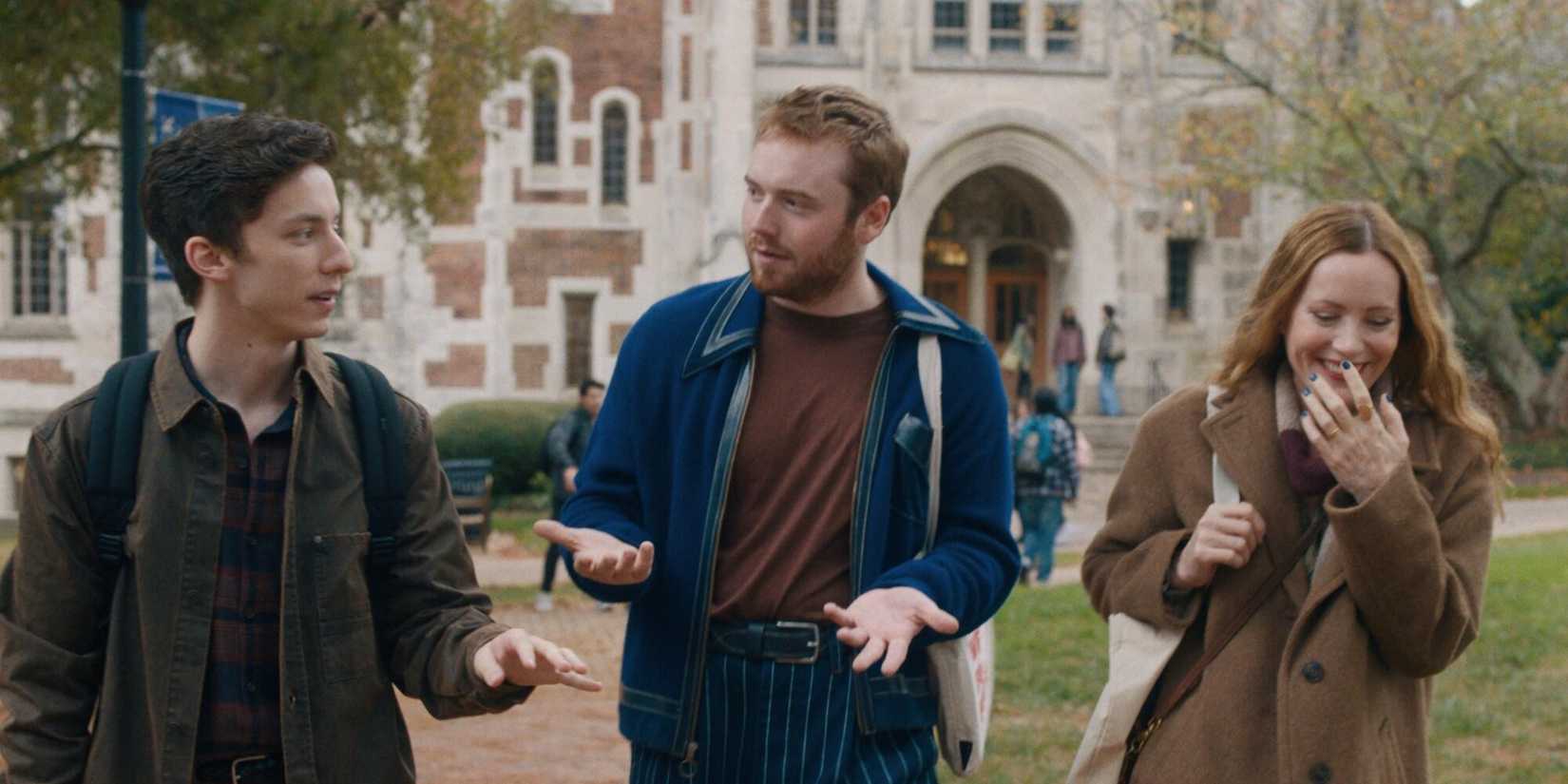 Andrew Barth Feldman and Cooper Hoffman and Leslie Mann walking and tallking on a college campus in Poetic License