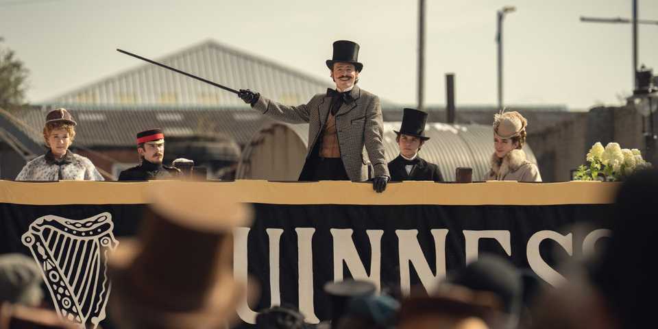 Arthur and his siblings at an event in House of Guinness season 1