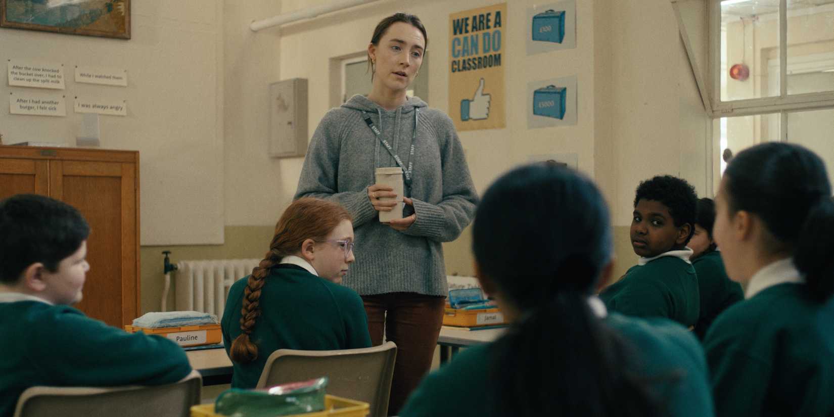 Saoirse Ronan looking bedraggled while teaching elementary schoolers in Bad Apples