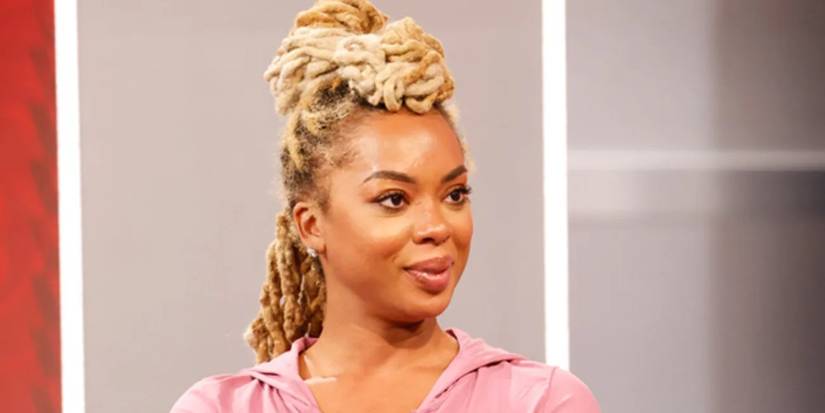 Big Brother 27's Mickey Lee wearing a pink hoodie in the studio post-eviction.
