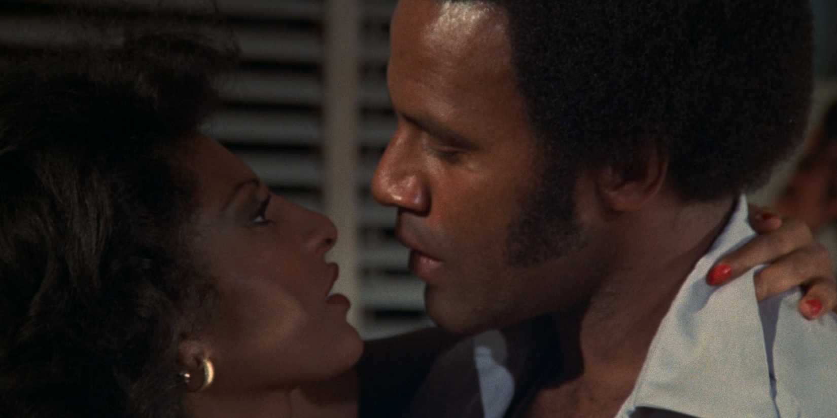 Pam Greir and Fred Williamson embracing in Bucktown