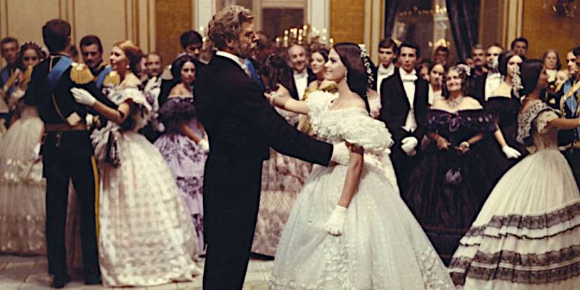 Burt Lancaster and Claudia Cardinale dance at a grand ball in a scene from The Leopard