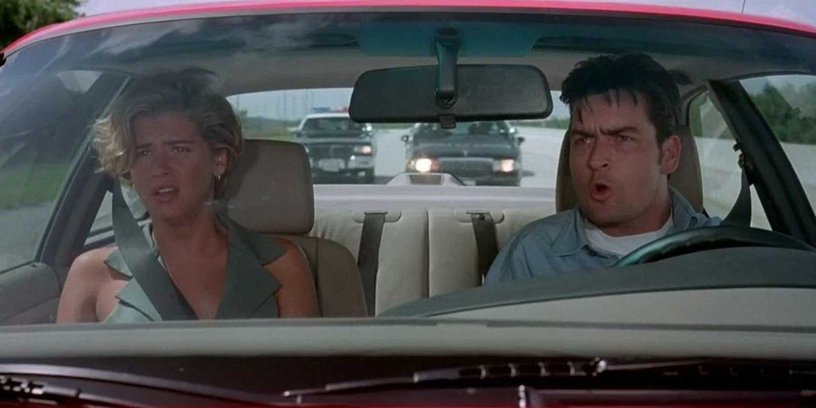 Charlie Sheen as Jack and Kristy Swanson as Natalie in a car in The Chase