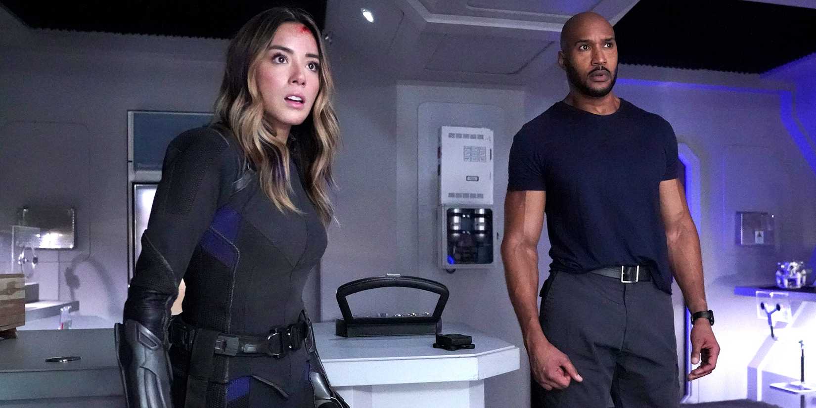 Chloe Bennet's Quake and Henry Simmons' Mack looking surprised at something in Agents of SHIELD
