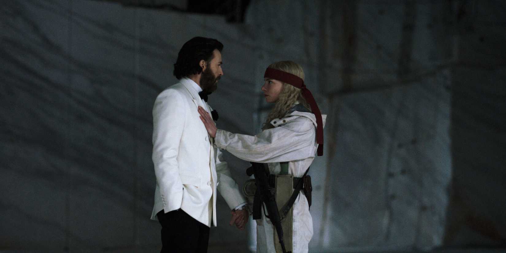 Anya Taylor-Joy pressing her hand to Chris Evans' chest in Sacrifice