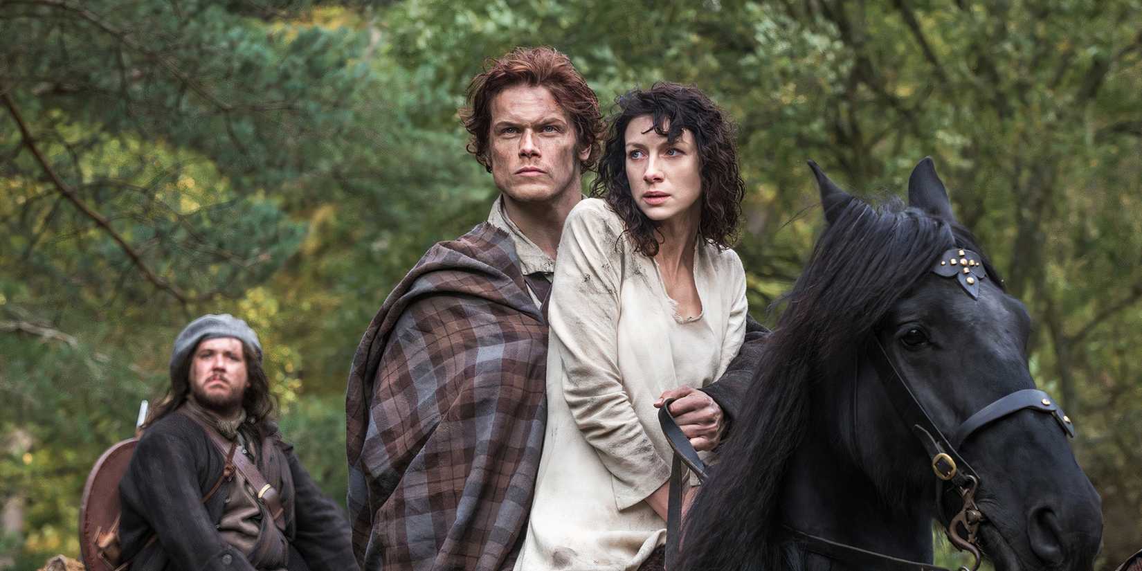 Claire and Jamie on a horse in Outlander