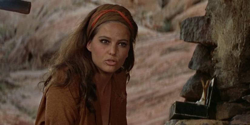 Claudia Cardinale talks to someone in a scene from The Professionals