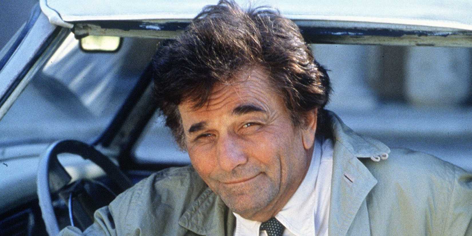 Columbo (Peter Falk) smiling in his car in Columbo.