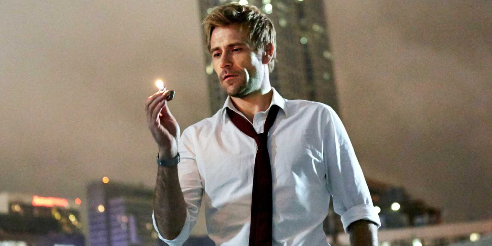 Constantine, center frame, holding a lit lighter in his hand, in Constantine