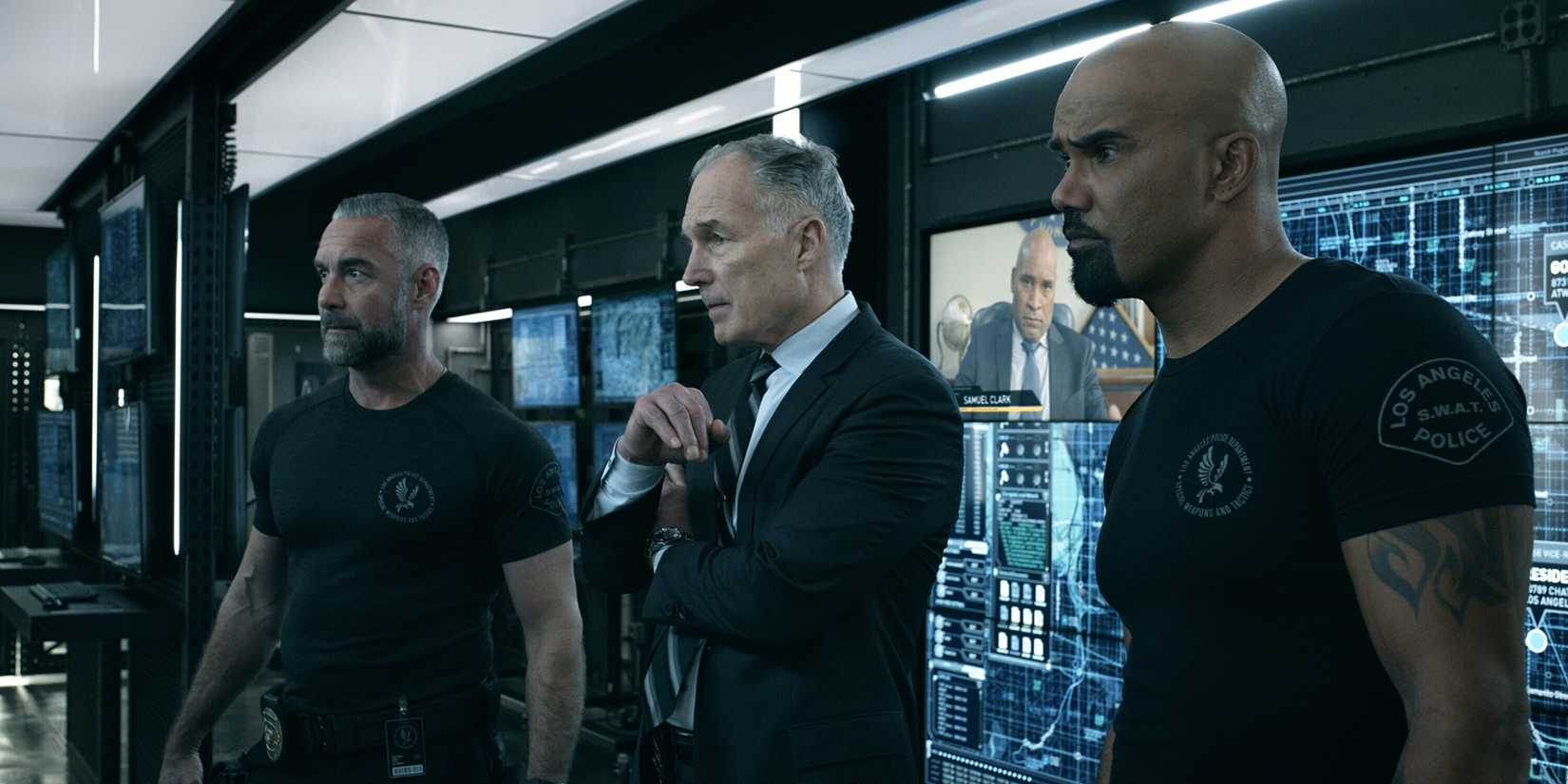 Deacon, Hicks, and Hondo standing together in an episode of SWAT