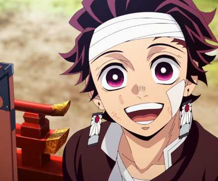 Demon Slayer's Tanjiro smiling with his mouth open next to Nezuko's box.