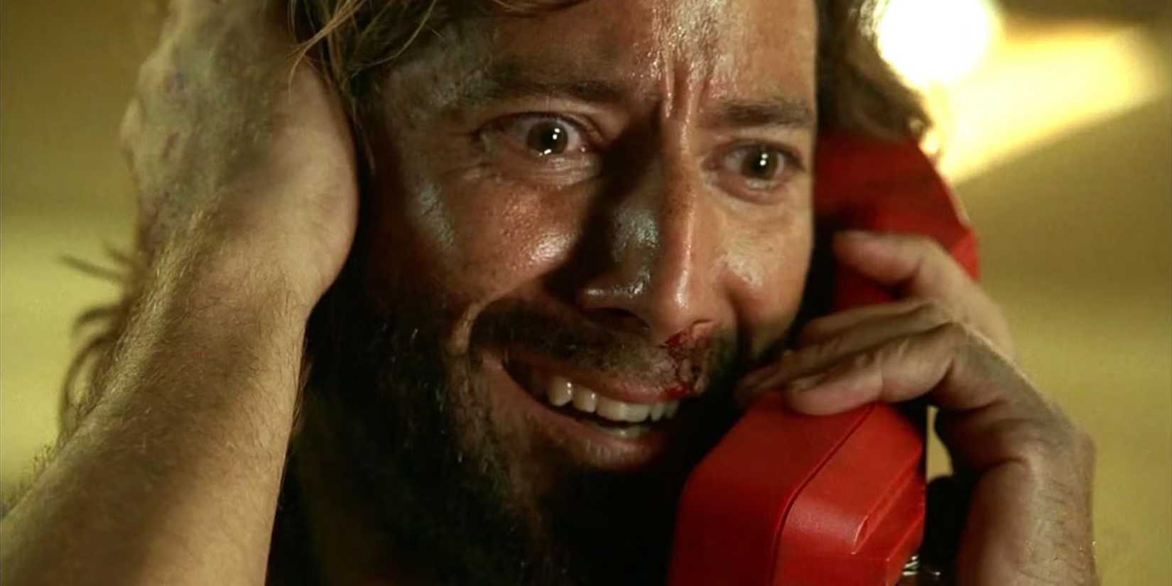 Desmond on the phone looking manic in Lost