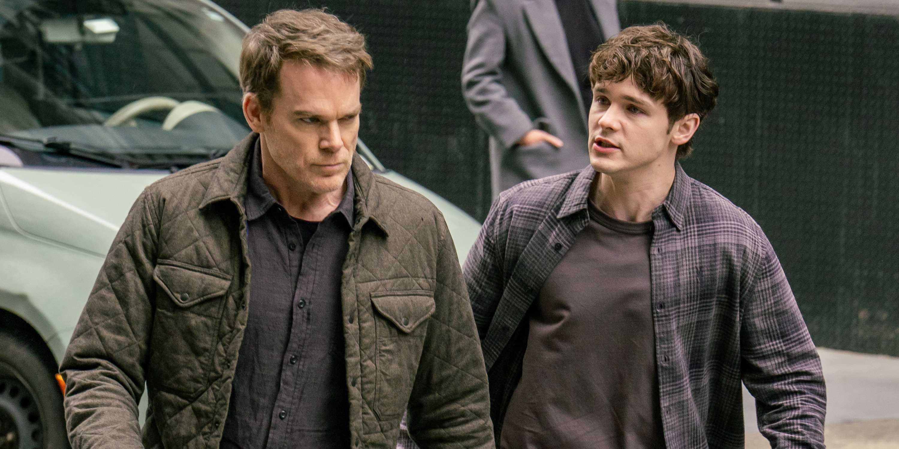 Dexter and Harrison Morgan walking in the street in Dexter Resurrection season 1