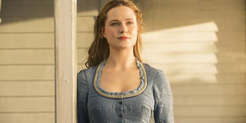 Evan Rachel Wood as Dolores Smiling on her front porch In Westworld