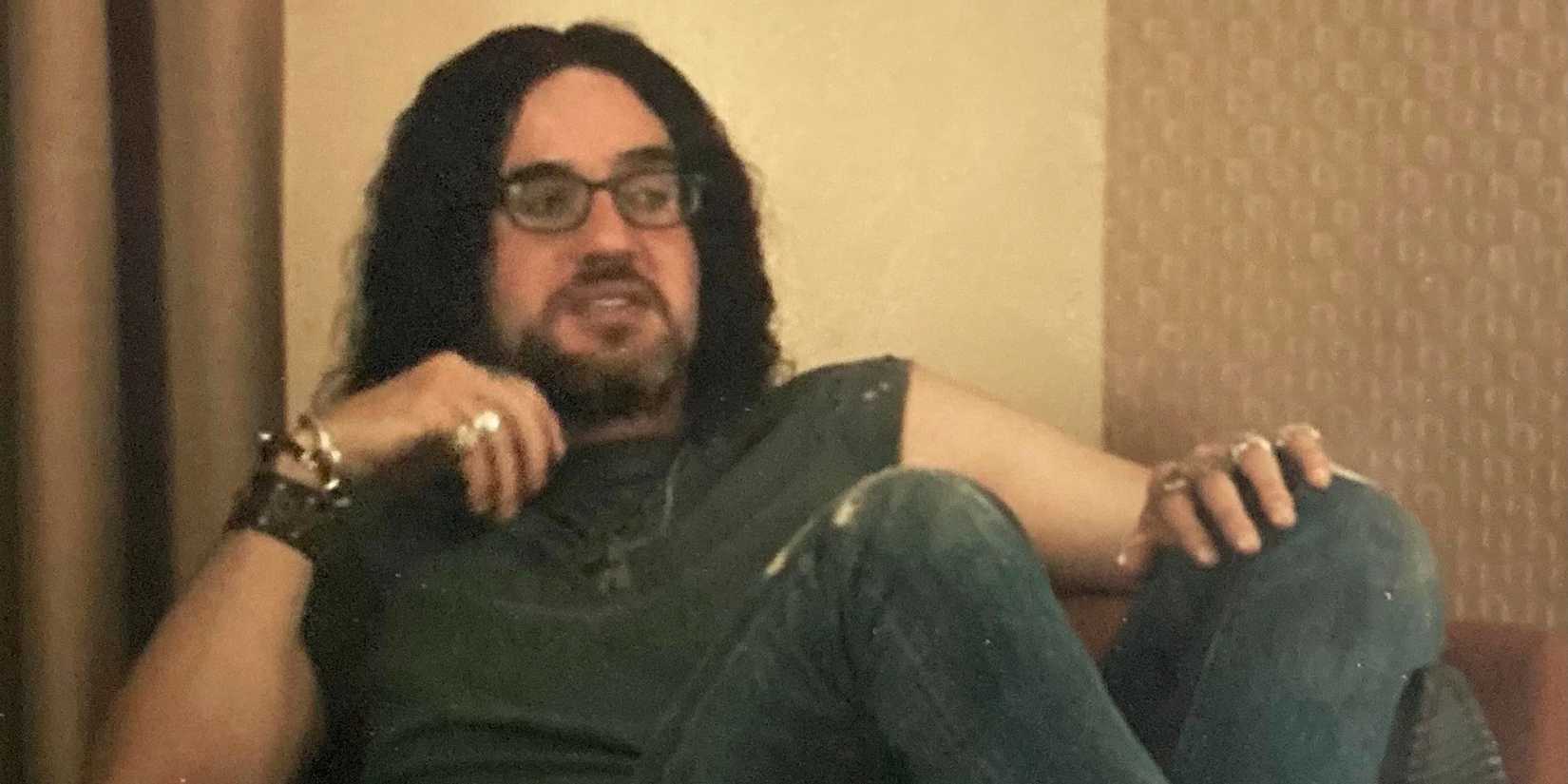 Dougie sitting in his hotel room in The Curse