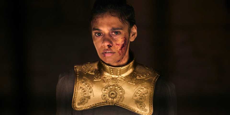 Egwene, midshot, bruised, bleeding, and battered, in The Wheel of Time