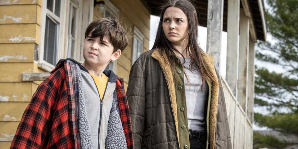 Ethan And Julie Matthews Looking unhappily at something off-screen In From