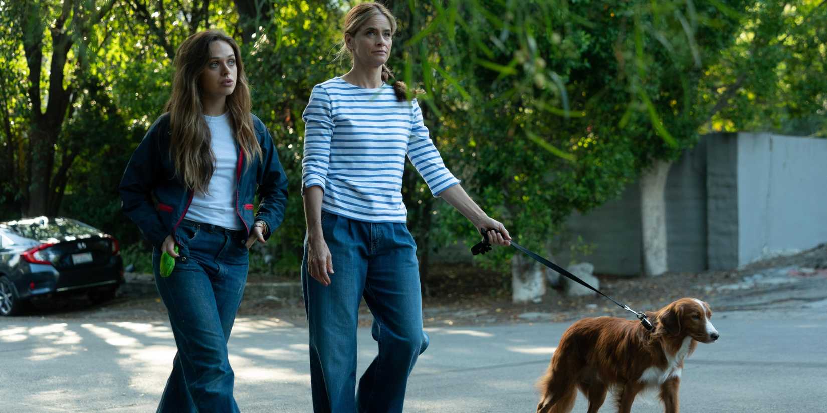 Ellen (Alyssa Jirrels) and Beth (Amanda Peet) walking outside in Fatal Attraction