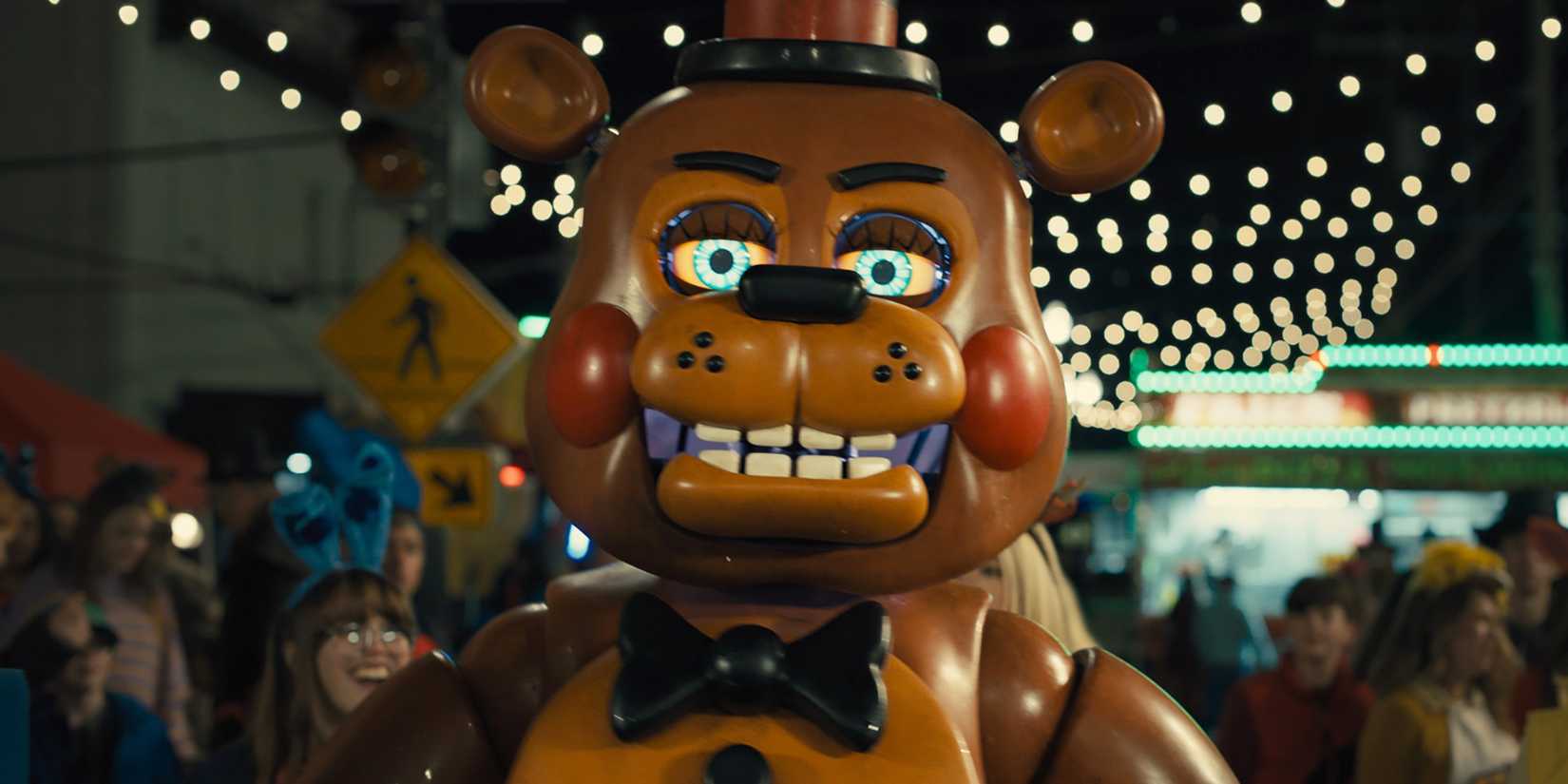 Freddy Fazbear walking through a crowd in Five Nights at Freddy's 2.
