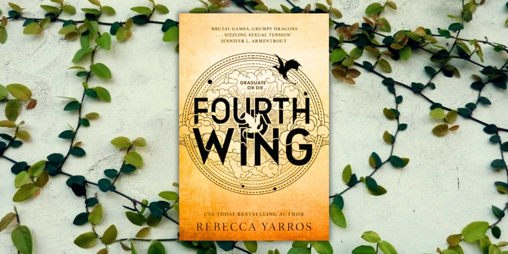The cover of the book Fourth Wing over a wall of vines