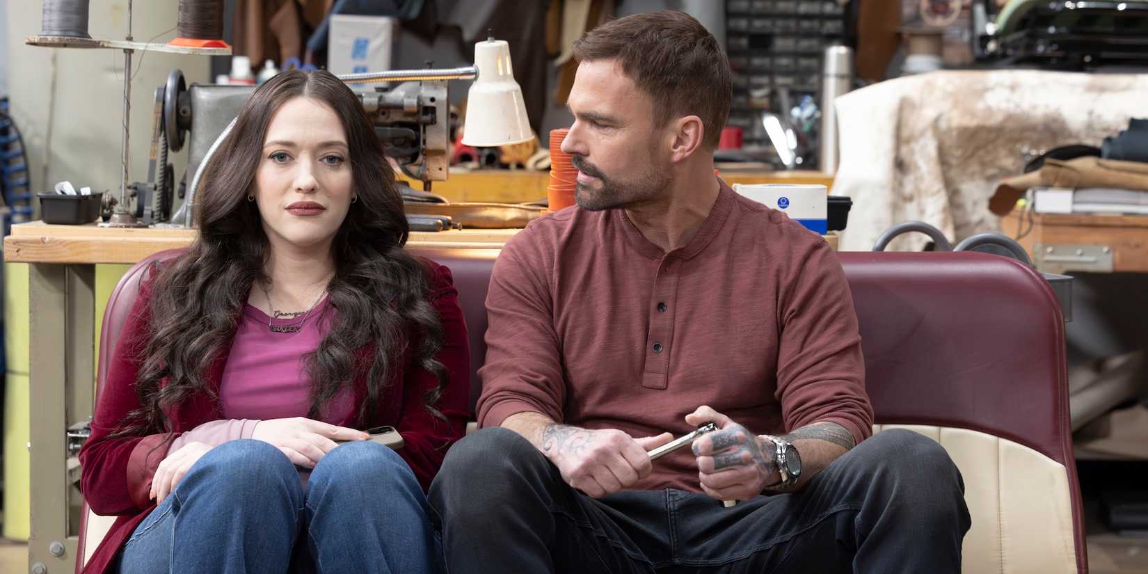 Gabe and Riley sit on a car backseat in the shop on Shifting Gears-1