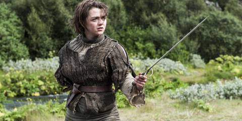 Maisie Williams as Arya Stark holding Needle in Game of Thrones