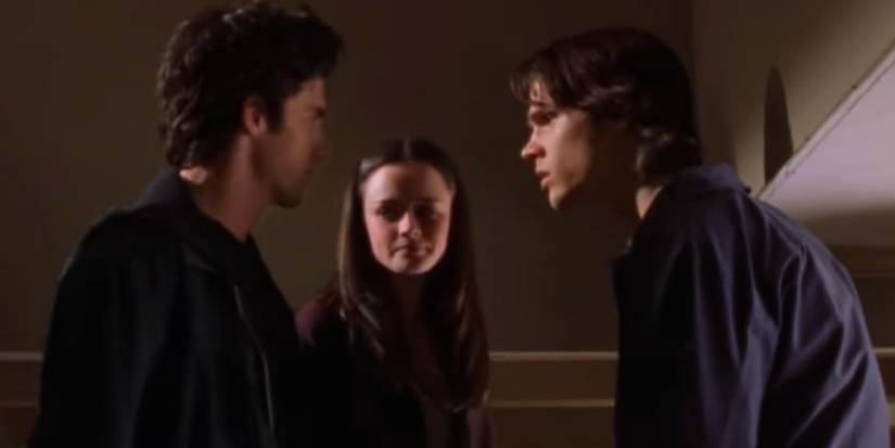 Jess and Dean fighting with Rory looking at them on Gilmore Girls