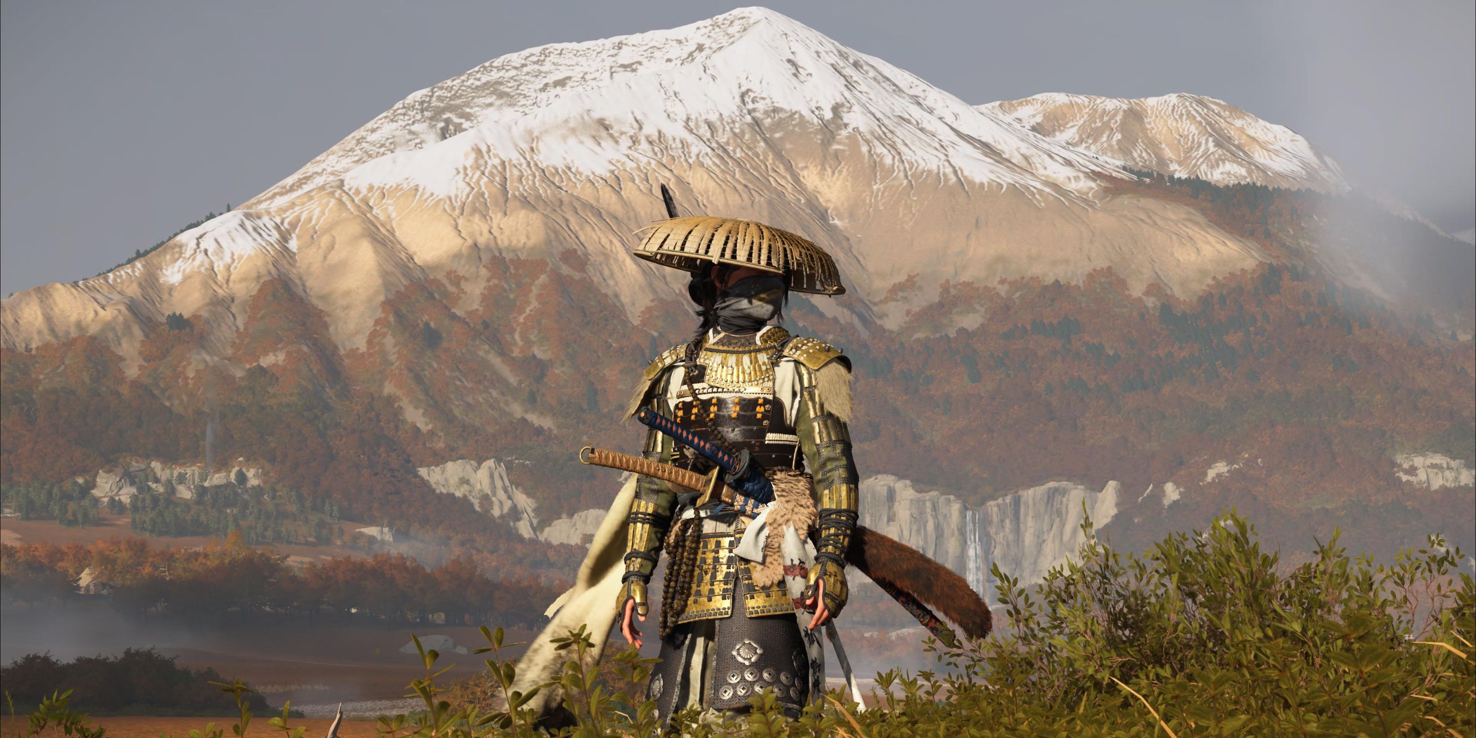 Ghost of Yotei Atsu standing in front of a mountain.