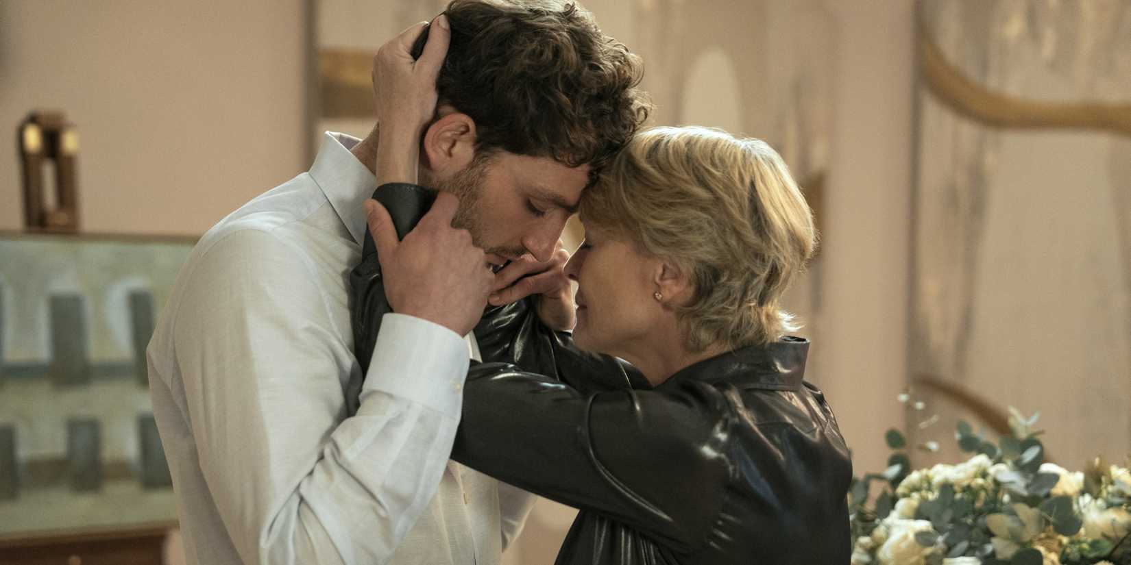 Daniel and Laura touch foreheads and close eyes while she puts her arms around his neck in The Girlfriend