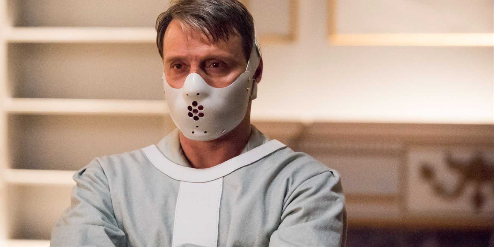 Hannibal Lecter (Mads Mikkelsen) in his muzzle mask and straitjacket in Hannibal