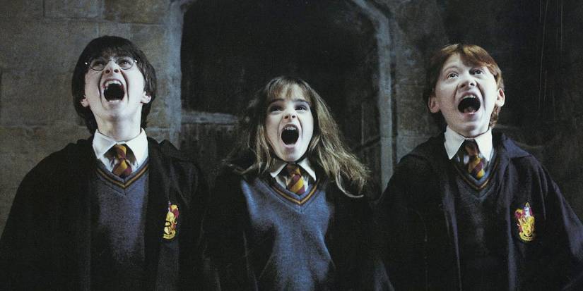 Harry, Ron e Hermione gritando em Harry Potter e a Pedra Filosofal