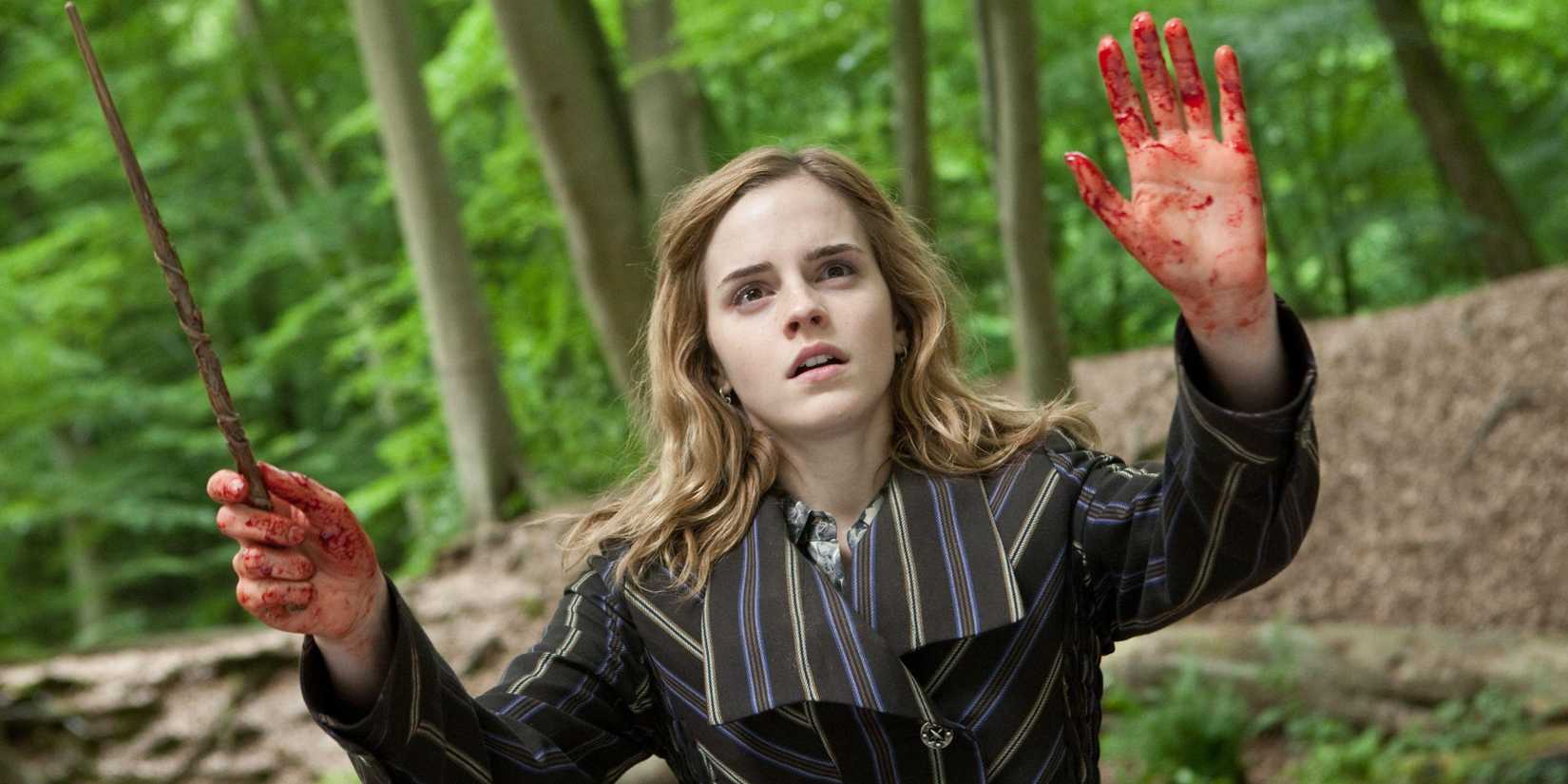 Hermione with her hands up with blood in Harry Potter and the Deathly Hallows Part 1