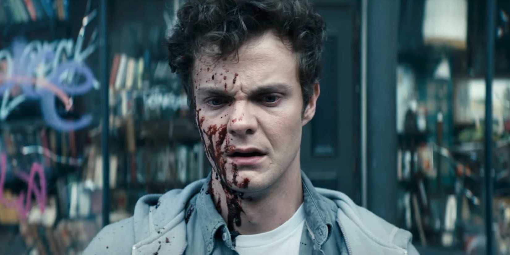 Hughie (Jack Quaid) with blood on his face in The Boys opening scene