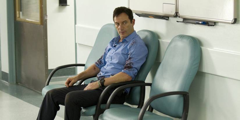 Jason Issacs in Awake, sitting in a chair.