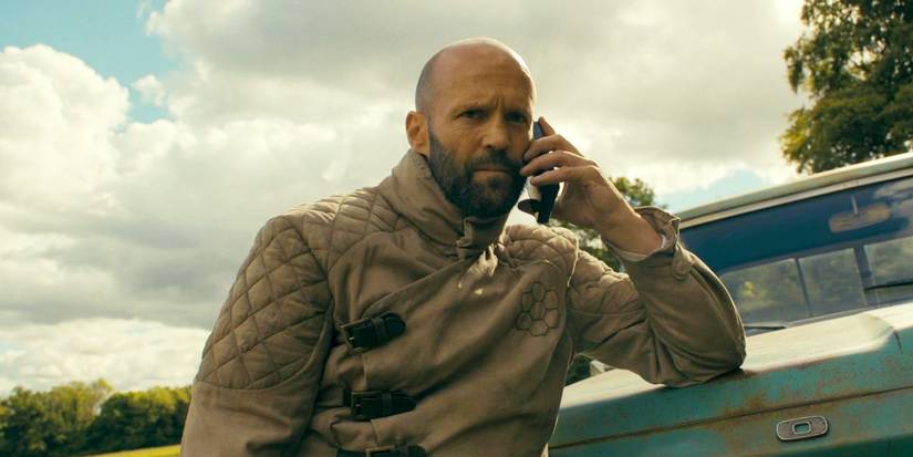 Jason Statham speaking on the phone with someone in The Beekeeper