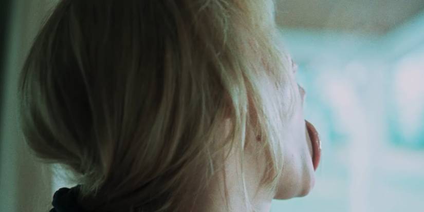 Jennifer Lawrence as Grace licking a window in Die My Love