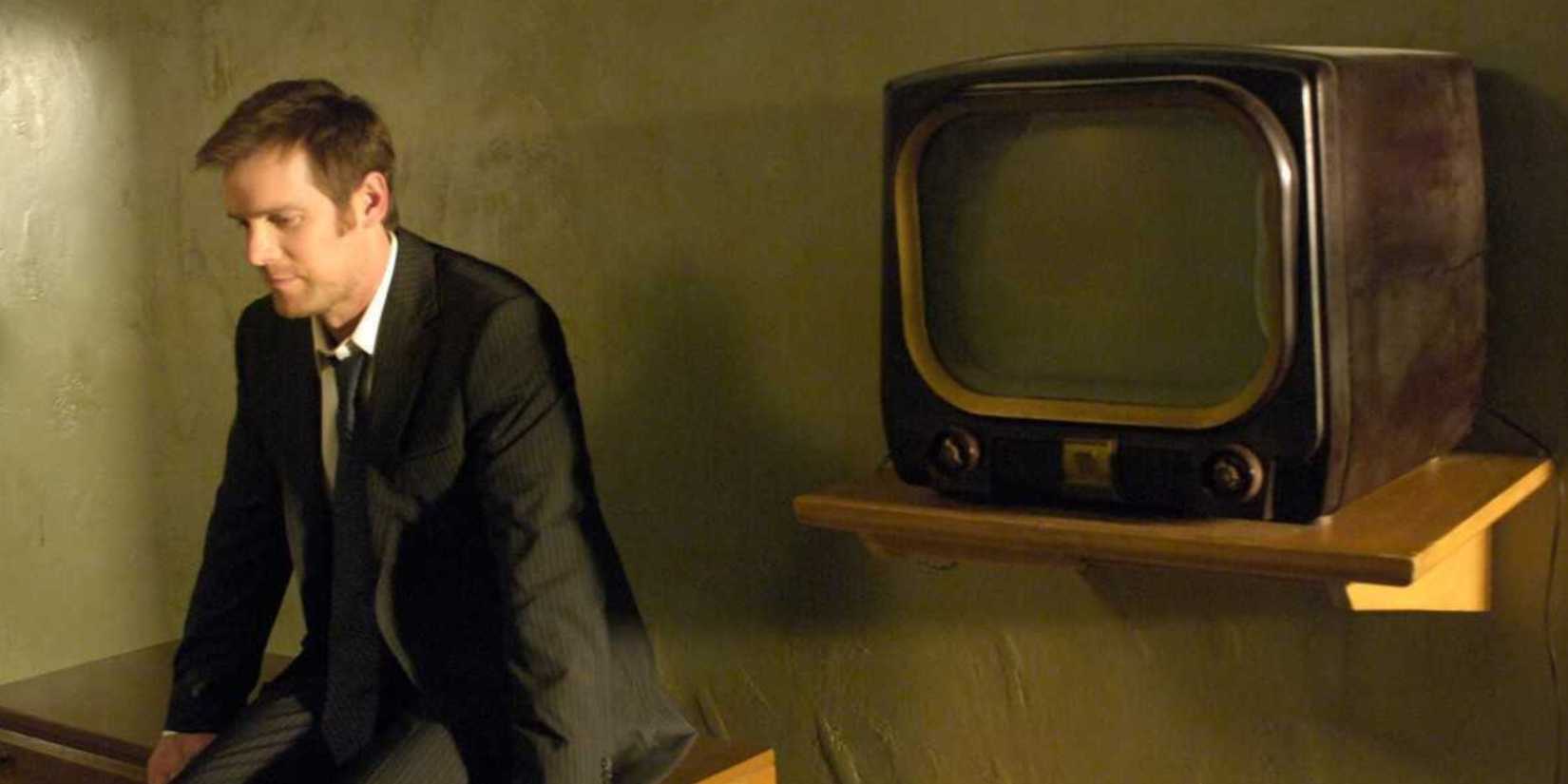 Joe Miller sitting alone in The Lost Room