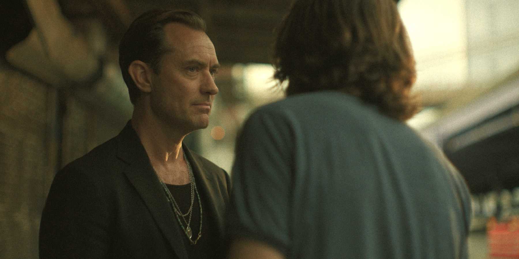 Jude Law looking at Jason Bateman in Black Rabbit