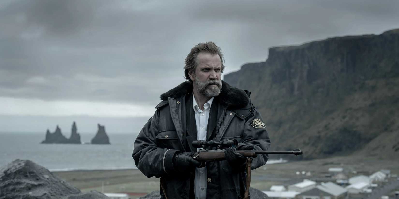 A man holding a gun in Katla