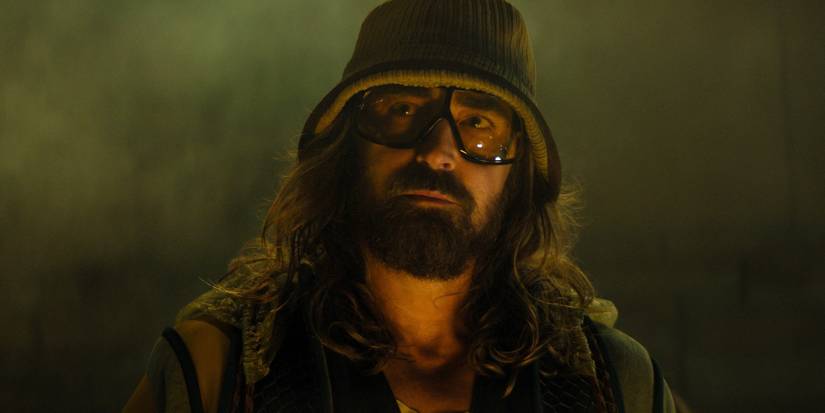 Lee Pace as Brother Day wearing a hat and glasses in Foundation season 3